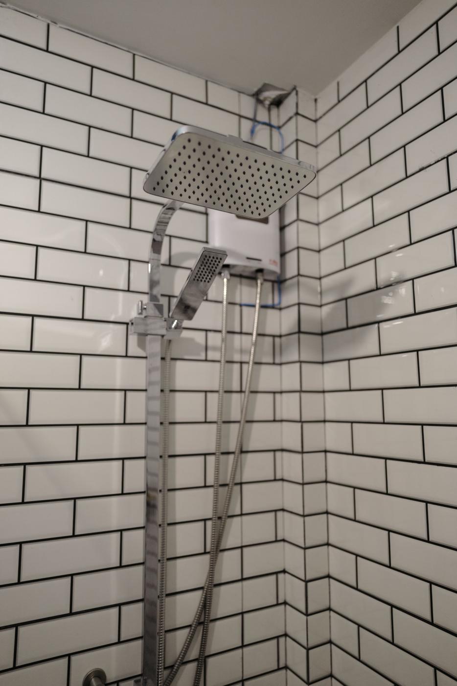 Rain shower with hot water heater