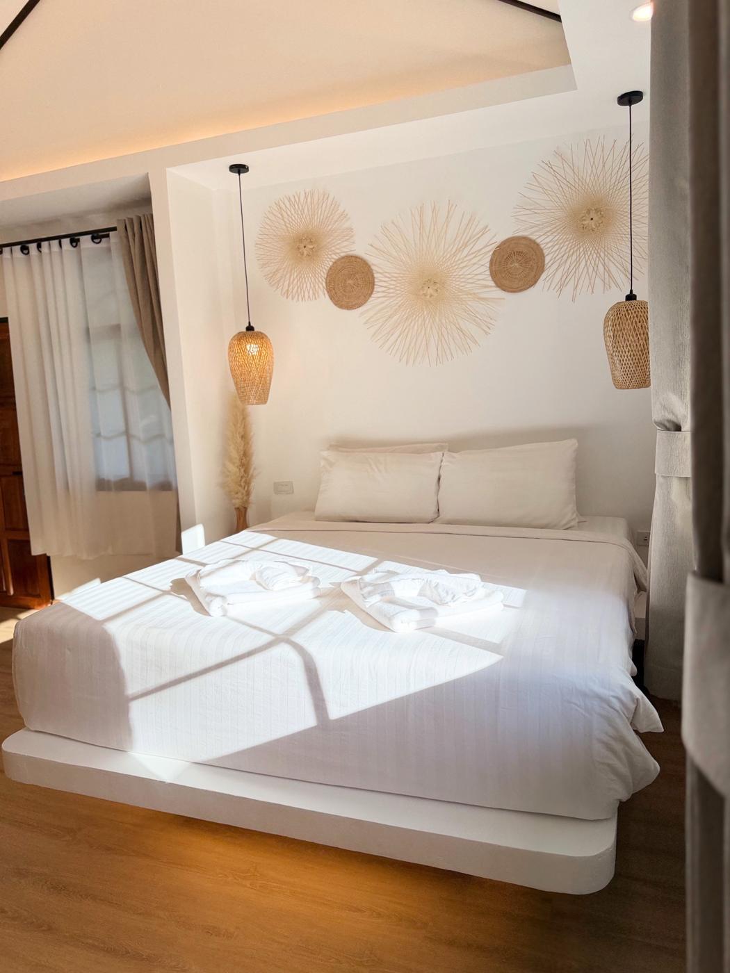 Sunlight across the king bed